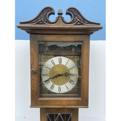 535 - A TRIPLE WEIGHT CARVED OAK GRANDFATHER CLOCK