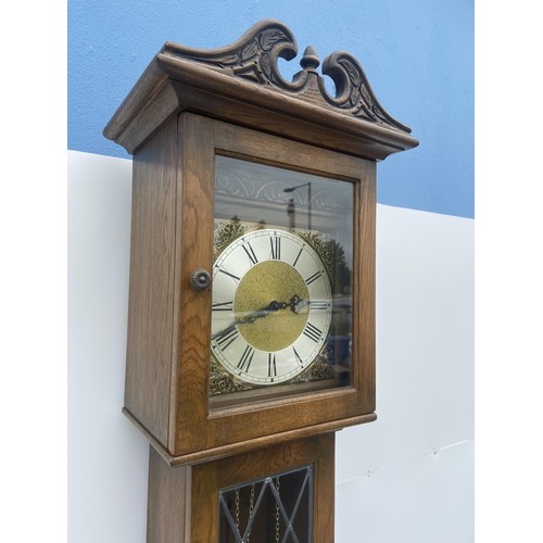 535 - A TRIPLE WEIGHT CARVED OAK GRANDFATHER CLOCK