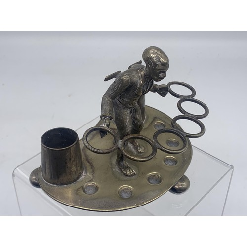 573 - UNUSAL BOY HIKING DESK TIDY/INKWELL