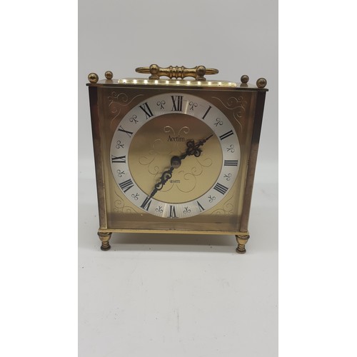 713 - A BRASS CARRIAGE CLOCK