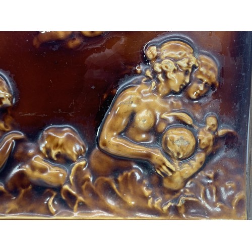 583 - A FRAMED WEDGEWOOD CHERUB PLAUQ MEASURES 9 1/2 x 12