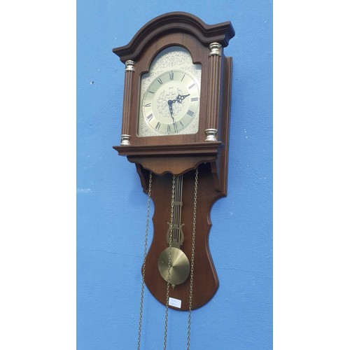 747 - A HOODED MAHOGANY TRIPLE WEIGHT WALL CLOCK