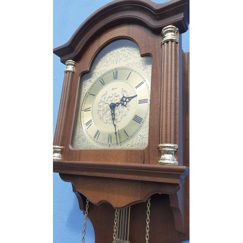 747 - A HOODED MAHOGANY TRIPLE WEIGHT WALL CLOCK