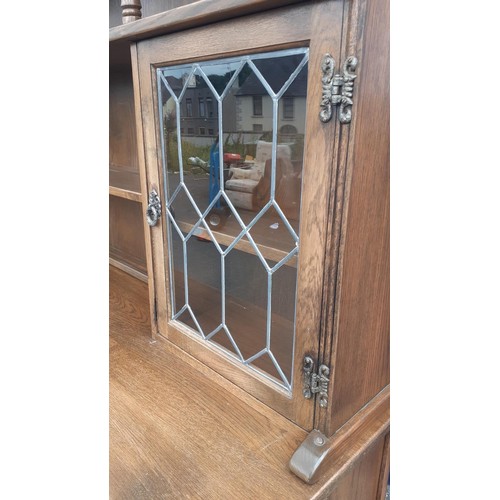 761 - AN ARCHED TOP OLD CHARM DRESSER WITH 2 LEADED GLASS DOORS 73 X 73 X 19IN