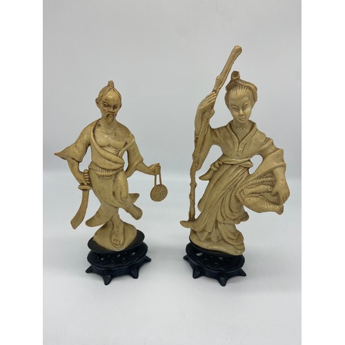 697 - 2 ORIENTAL FIGURINES 9IN TALL