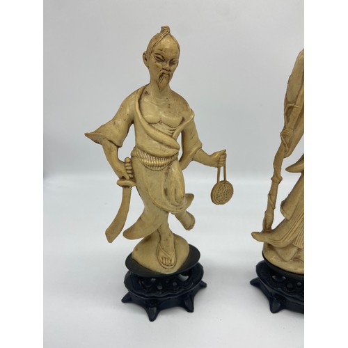 697 - 2 ORIENTAL FIGURINES 9IN TALL