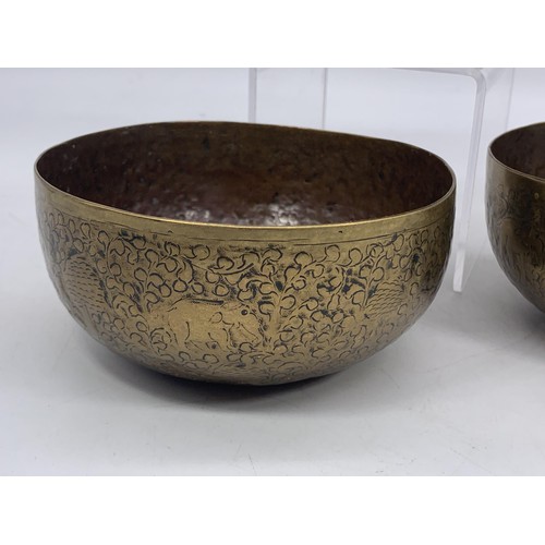 725 - 2 INDIAN BRASS SINGING BRASS BOWLS AND AN EMBOSSED INDIAN BOWL