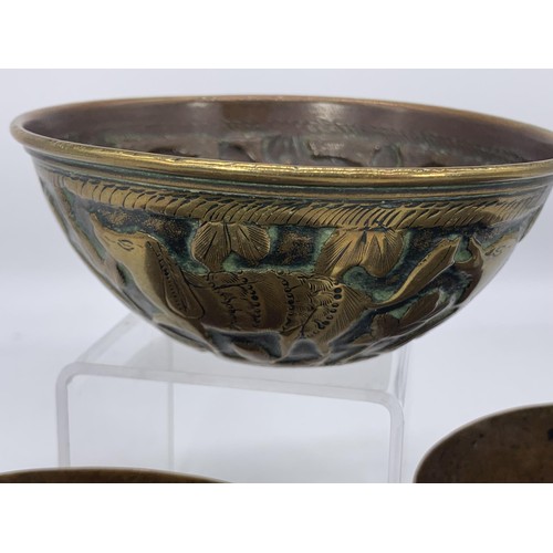 725 - 2 INDIAN BRASS SINGING BRASS BOWLS AND AN EMBOSSED INDIAN BOWL