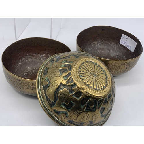 725 - 2 INDIAN BRASS SINGING BRASS BOWLS AND AN EMBOSSED INDIAN BOWL