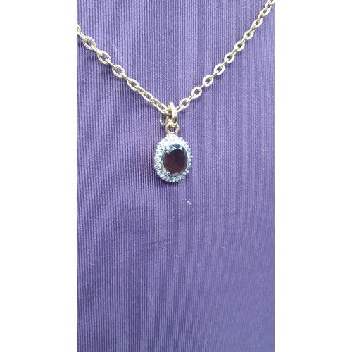 218 - AN AMETHYST AND GEM SET PENDANT ON GILT CHAIN