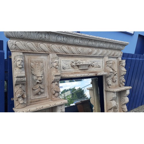 600A - AN ANTIQUE  HEAVILY CARVED OVERMANTLE WITH  LADY AND GENT HEADS 64 X 64IN