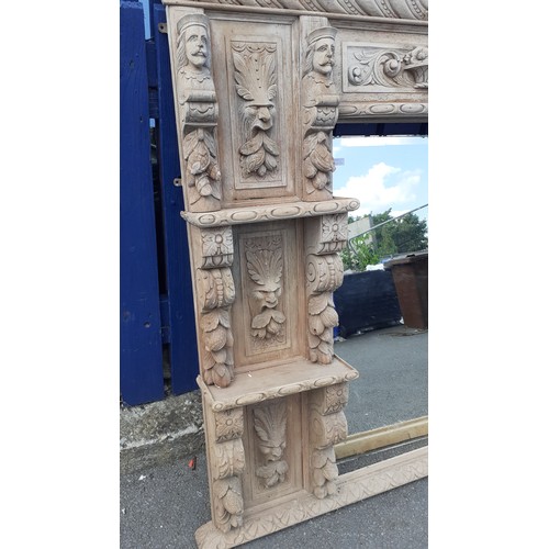 600A - AN ANTIQUE  HEAVILY CARVED OVERMANTLE WITH  LADY AND GENT HEADS 64 X 64IN