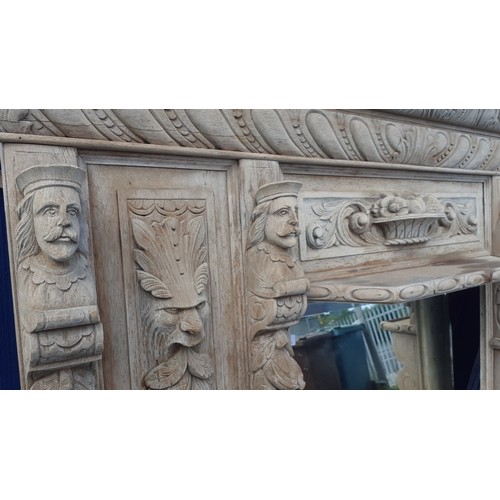 600A - AN ANTIQUE  HEAVILY CARVED OVERMANTLE WITH  LADY AND GENT HEADS 64 X 64IN