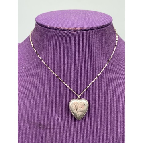 210 - A SILVER HEART LOCKET ON SILVER CHAIN IN BOX