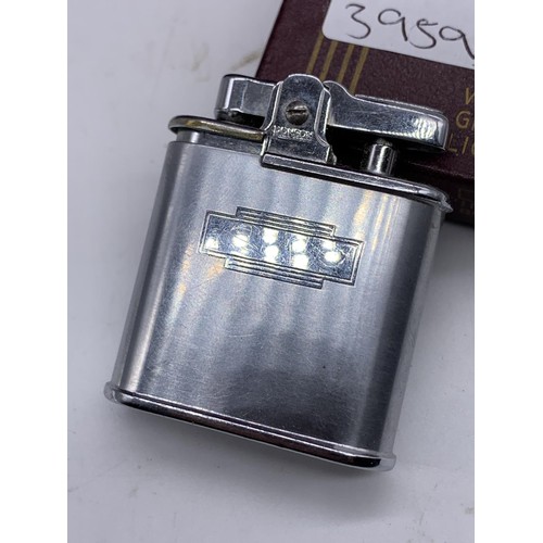 212 - A CASED RONSON LIGHTER