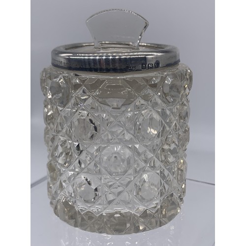 226 - AN ANTIQUE CUT GLASS JAR WITH A SILVER TRIM WITH A GLASS STOPPER