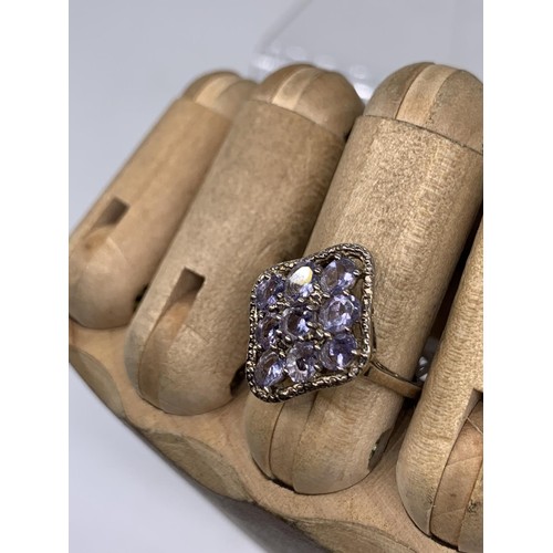 235 - A SILVER AND AMETHYST RING