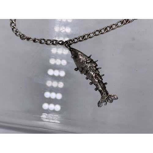 236 - A SILVER CHARM BRACELET WITH FISH,BANJO,OIL CONTAINER AND BIRD CAGE