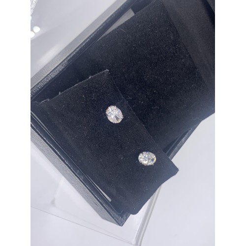 261 - A PAIR OF SILVER SOLITAIRE EARRINGS