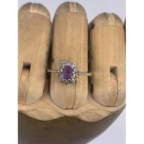 270 - A SILVER AMETHYST & GEM  SET RING