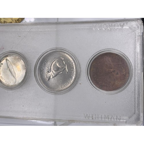 279 - CASED CANADIAN COINS AND 3 OTHERS