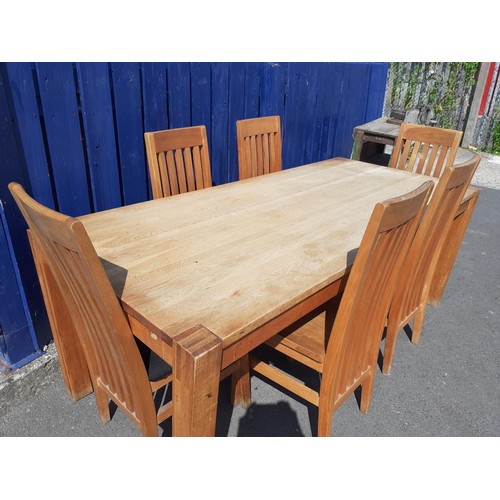 94 - A LIGHT OAK TABLE AND 6 OAK SPLAT  BACK CHAIRS