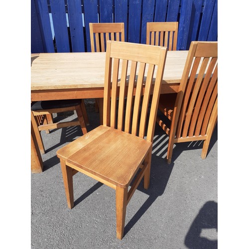 94 - A LIGHT OAK TABLE AND 6 OAK SPLAT  BACK CHAIRS