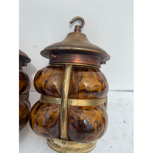 125 - PAIR OF SHAPED RETRO AMBER AND BRASS LANTERNS