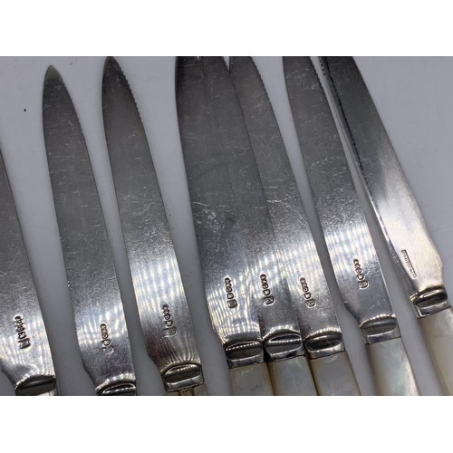 127 - 12 M.O.P.HANDLED FORKS AND 9 M.O.P HANDLED KNIVES