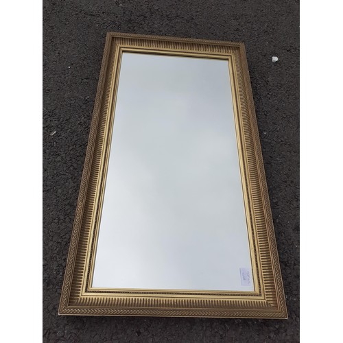 49 - A GILT FRAMED MIRROR 34X18