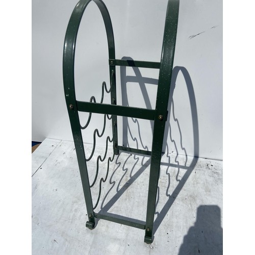 56 - A GREEN METAL WINE RACK