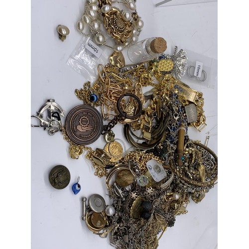 63 - A BAG OF MIXED COSTUME JEWELLERY