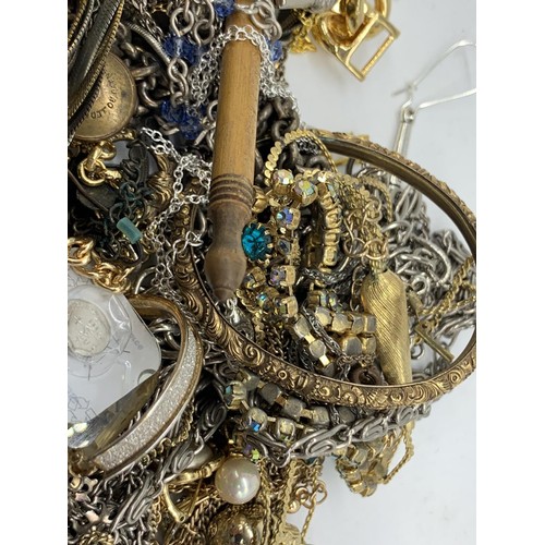 63 - A BAG OF MIXED COSTUME JEWELLERY