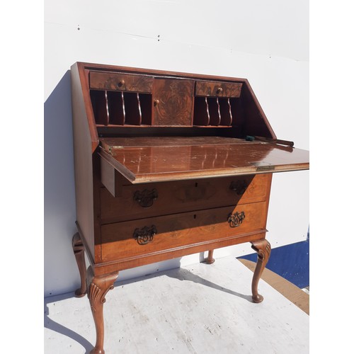 155 - A WALNUT WRITING BUREAU WITH SHELL MOTIF