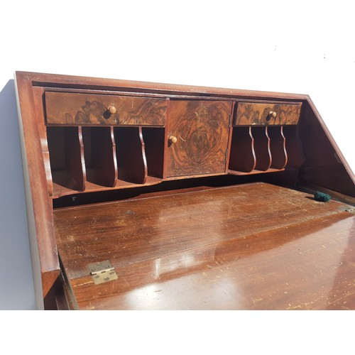 155 - A WALNUT WRITING BUREAU WITH SHELL MOTIF