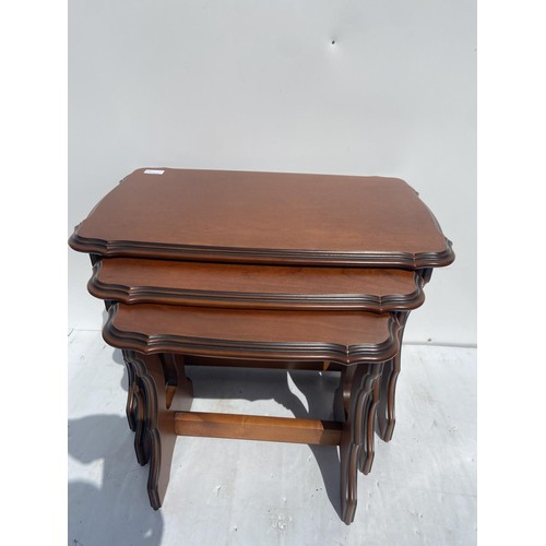 88 - A MAHOGANY NEST OF 3 TABLES