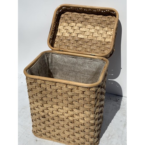 164 - A WICKER LAUNDRY BASKET