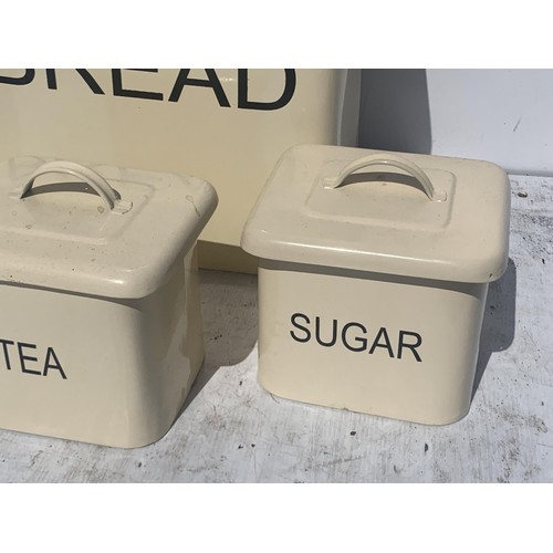 170 - A CREAM METAL KITCHEN SET COMPRISING BREADBIN TEA COFFEE AND SUGAR