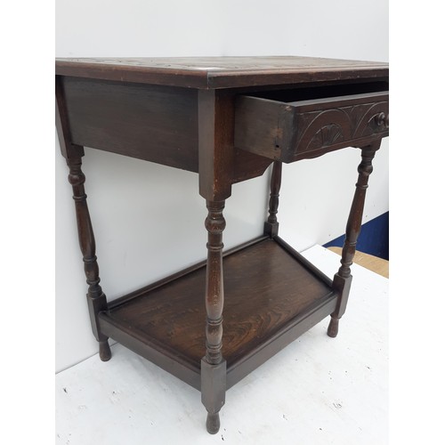 178 - A CARVED OAK CUT CORNER HALL TABLE