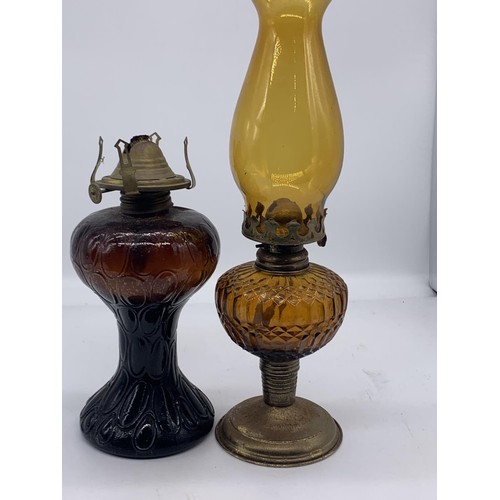 307 - 2 AMBER GLASS OIL LAMPS