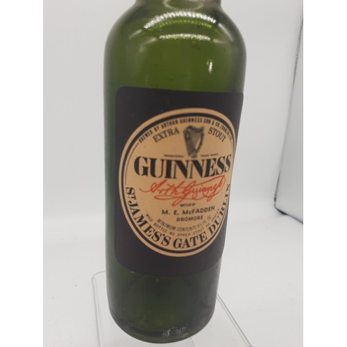 319 - AN OLD GUINNESS BOTTLE