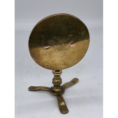 330 - A VICTORIAN BRASS TRIPOD BASED CIRCULAR SWIEL TOP STAND 7in