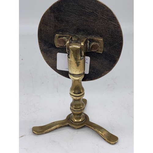 330 - A VICTORIAN BRASS TRIPOD BASED CIRCULAR SWIEL TOP STAND 7in