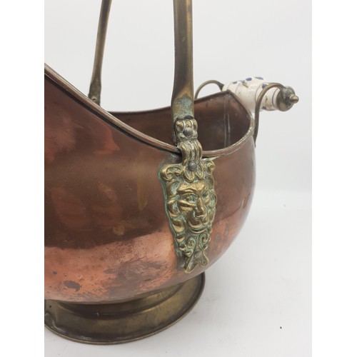 346 - A COPPER COAL SCUTTLE WITH PORCELAIN HANDLE