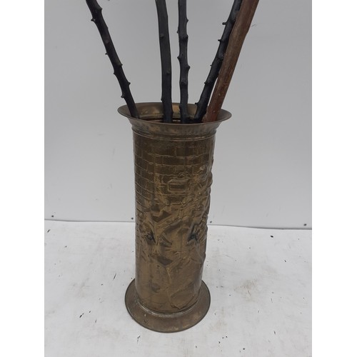 371 - A BRASS STICKSTAND AND CONTENTS (WALKING STICKS)