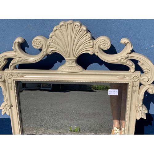 283 - AN ORNATE CREAM FRAMED MIRROR 41 x 24