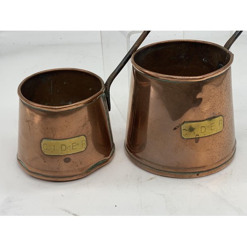 408 - 2 COPPER CIDER MEASURES WITH CAST HANDLES