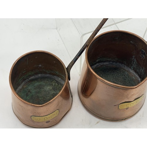 408 - 2 COPPER CIDER MEASURES WITH CAST HANDLES