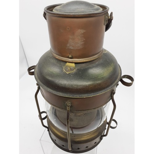 415 - A BRASS AND COPPER KEROSENE LANTERN 11in