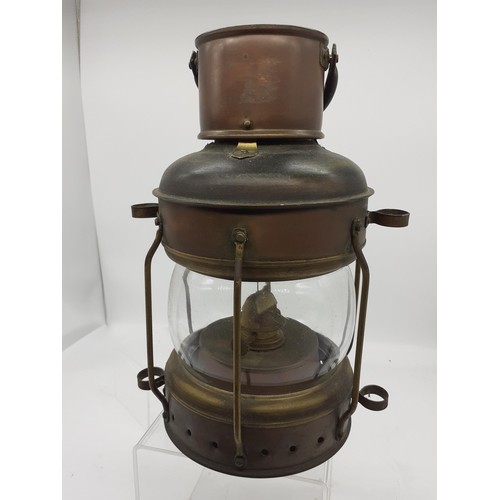 415 - A BRASS AND COPPER KEROSENE LANTERN 11in